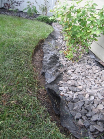 homowner pulled out plastic , pushed back rock and reshaped it. Very good!