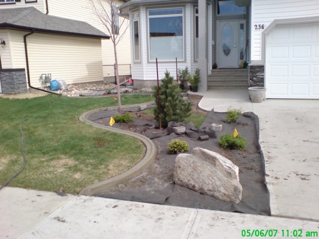 we cleaned up the rough edge and installed this curb