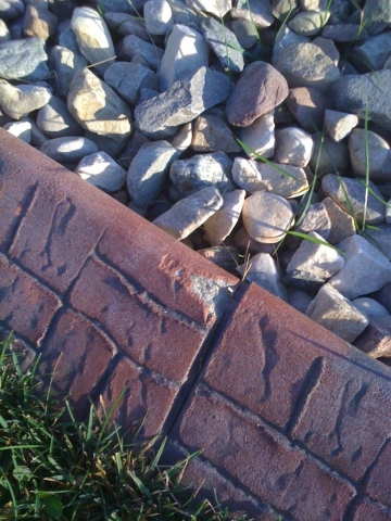 Kiwi Kerb curb using slurry coat gets these chips that cannot be fixed