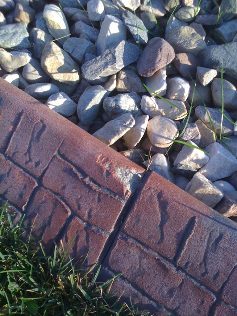 a competitor's kwik kerb using the slurry coat they brag about- shows white when chipped- not repairable. Slurry makes bright colours, but doesnt last well.