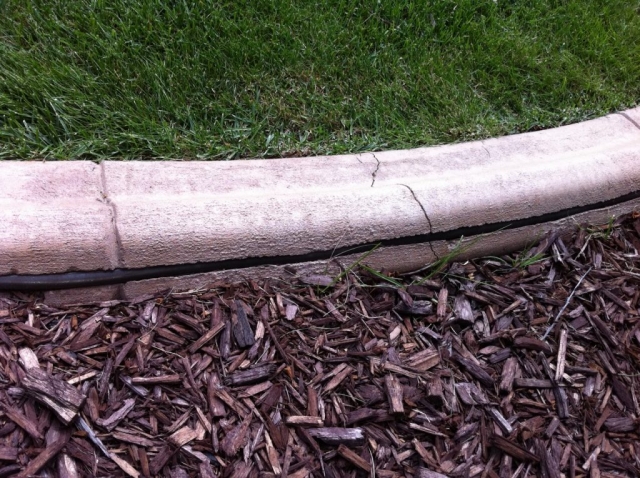 note rough finish and crack in curb