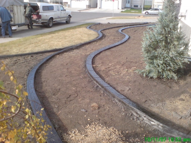 curb breaks up a big blank side yard