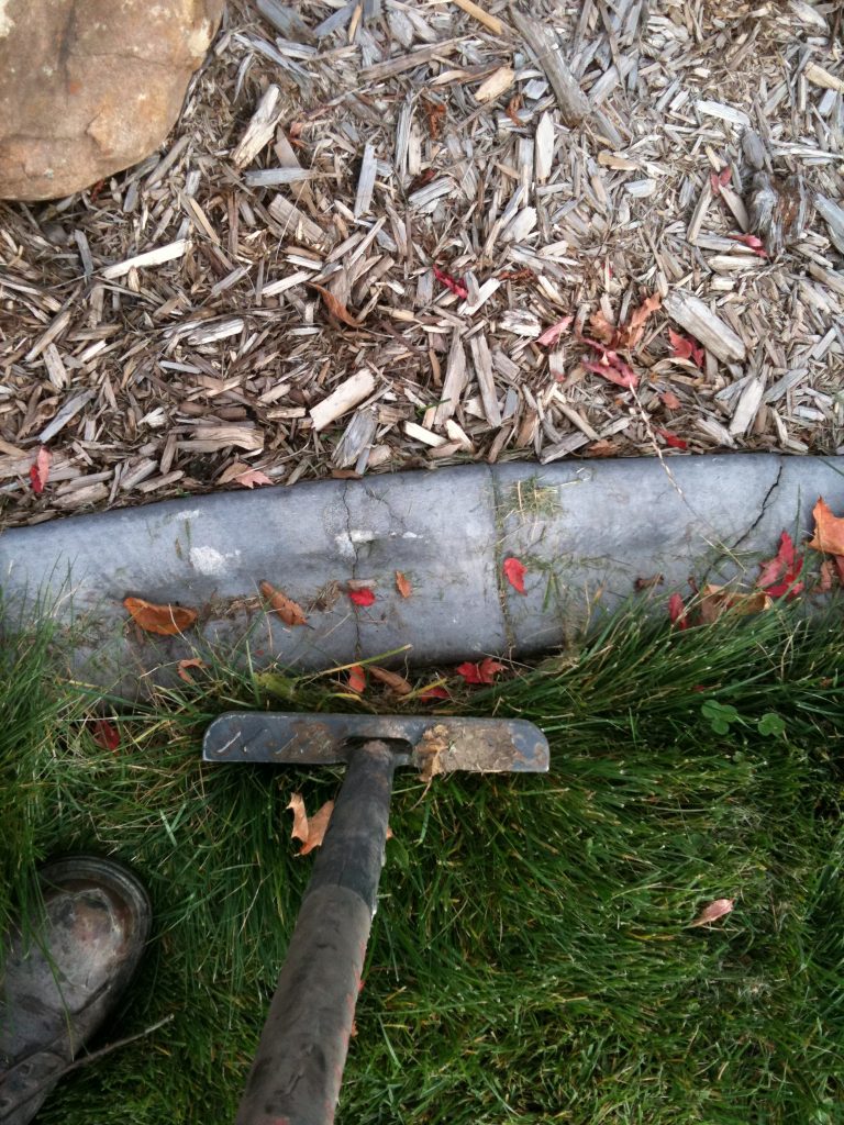 Half moon edger at work Best Curb and Curbify Inc.