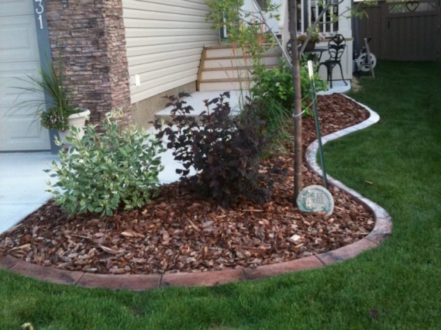 typical front bed area curb colour goes well with stonework on house